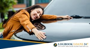 A lady hugging a car
